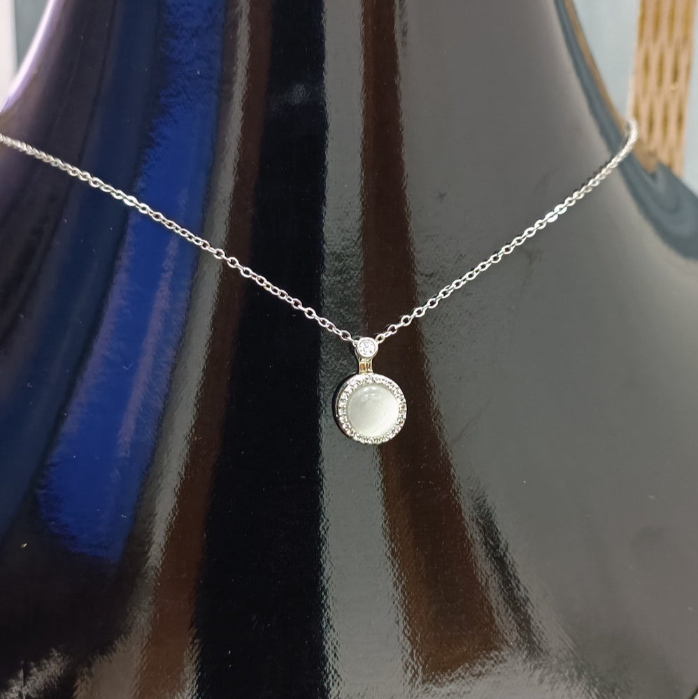 Elegant Silver Pendant Necklace with White Gemstone and Diamond Accents