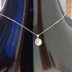 Elegant Silver Pendant Necklace with White Gemstone and Diamond Accents