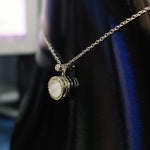 Elegant Silver Pendant Necklace with White Gemstone and Diamond Accents