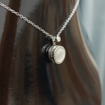 Elegant Silver Pendant Necklace with White Gemstone and Diamond Accents