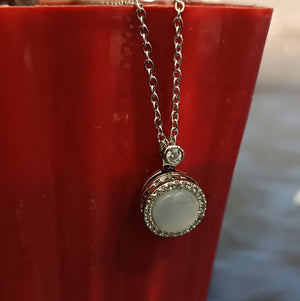 Elegant Silver Pendant Necklace with White Gemstone and Diamond Accents