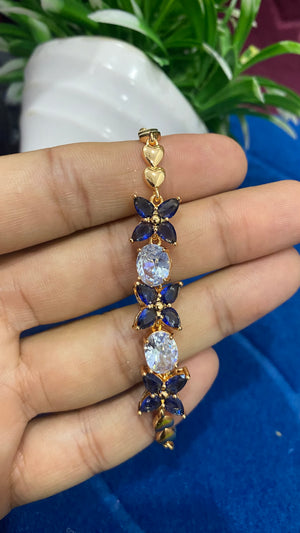 Golden Bracelet with Blue and White CZ Stones – Elegant Women's Jewelry