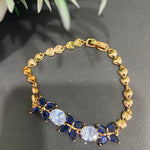 Golden Bracelet with Blue and White CZ Stones – Elegant Women's Jewelry