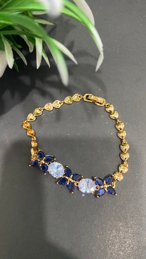 Golden Bracelet with Blue and White CZ Stones – Elegant Women's Jewelry