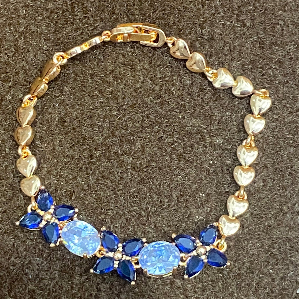 Golden Bracelet with Blue and White CZ Stones – Elegant Women's Jewelry