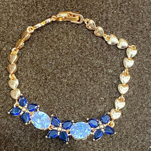 Golden Bracelet with Blue and White CZ Stones – Elegant Women's Jewelry