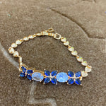 Golden Bracelet with Blue and White CZ Stones – Elegant Women's Jewelry