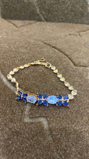Golden Bracelet with Blue and White CZ Stones – Elegant Women's Jewelry