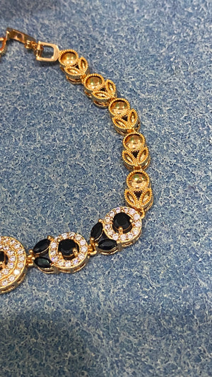 Golden Bracelet with Black and White CZ Circles – Elegant Women's Jewelry